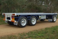 Blue Three Axle Dog Trailer